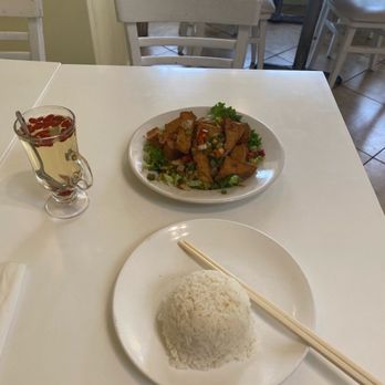 Loving Hut - I forget the name but it's spicy tofu with vegetables and white rice. Over there on the side is the ginseng goji berry tea that I live for! - Vegan Near Me - San Francisco, California Loving Hut - I forget the name but it's spicy tofu with vegetables and white rice. Over there on the side is the ginseng goji berry tea that I live for! - Vegan Near Me - San Francisco, California