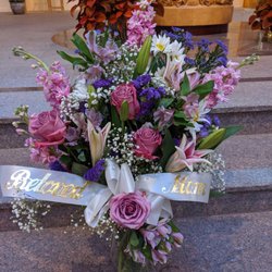 Flowers by Sharon Anne - 2 gorgeous matching arrangements on both sides of the urn from her children and her grandchildren.