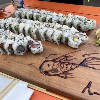Samurai Kitchen + Sushi - Fish drawing our sushi board of tuna avocado, salmon avocado, and yellowtail rolls - Sushi Bars Near Me - Erie, Pennsylvania