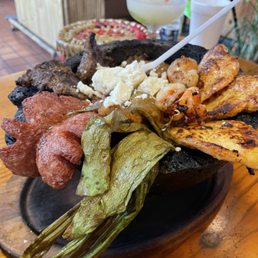 Molcajete, with pretty much everything. Beef, chicken, shrimp, cactus, sausage. Molcajete, with pretty much everything. Beef, chicken, shrimp, cactus, sausage.