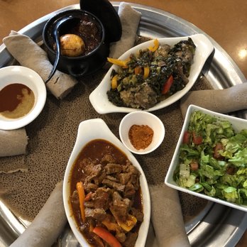 Hdmona Restaurant - a variety of food items on a tray - Ethiopian Near Me - Calgary, Alberta Hdmona Restaurant - a variety of food items on a tray - Ethiopian Near Me - Calgary, Alberta