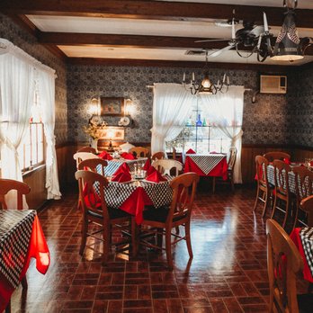 Daphne Lodge Restaurant - a dining room with red and white tablecloths - New American Near Me - Cordele, Georgia