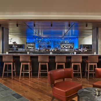 Snowmass Kitchen - a bar with stools - New American Near Me - Snowmass Village, Colorado Snowmass Kitchen - a bar with stools - New American Near Me - Snowmass Village, Colorado