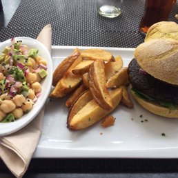 Vegan burger, wedge fries, garbanzo bean salad. Vegan burger, wedge fries, garbanzo bean salad.