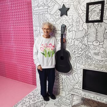 Original Selfie Museum - My Grandma played the guitar in a band for many years in her 60s and 70s, so she wanted to pose with the fake guitar. April 2023. - Art Museums Near Me - Seattle, Washington