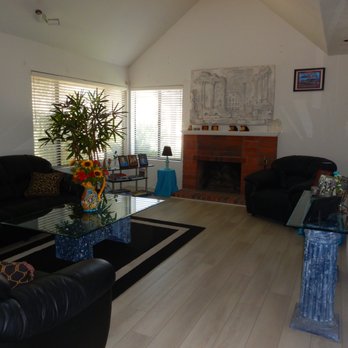 Floor It San Diego - a living room with a fireplace - Flooring Near Me - San Diego, California Floor It San Diego - a living room with a fireplace - Flooring Near Me - San Diego, California
