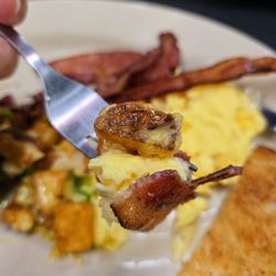 Nadines Hash House - Traditional Breakfast with the breakfast potatoes smothered in peppers, onions, and cheese