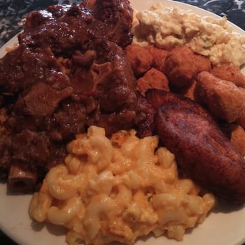 Sandra's Next Generation - Ox tail special with 4 sides: potato salad, fried okra, plantain, and mac n cheese. - Soul Food Near Me - New Haven, Connecticut Sandra's Next Generation - Ox tail special with 4 sides: potato salad, fried okra, plantain, and mac n cheese. - Soul Food Near Me - New Haven, Connecticut
