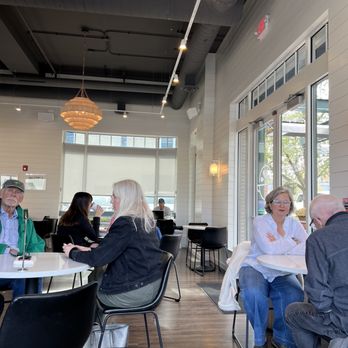 Hometown Coffee & Juice - a group of people sitting at a table - Juice Bars & Smoothies Near Me - Lake Forest, Illinois