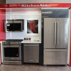 Rogers Appliances - A sleek KitchenAid kitchen suite including refrigerator, range, microwave, and dishwasher at Roger's Appliances.