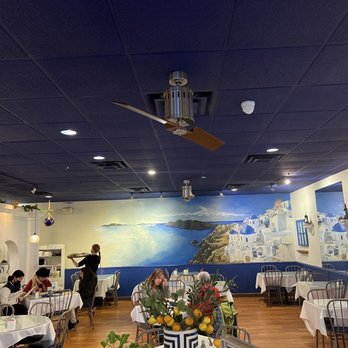 Greek Islands - a dining room with a ceiling fan - Greek Near Me - Omaha, Nebraska Greek Islands - a dining room with a ceiling fan - Greek Near Me - Omaha, Nebraska