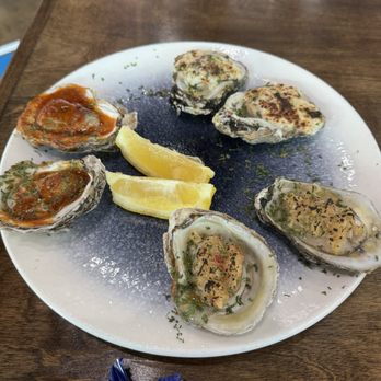 7 Seas Oyster Bar - 1/2 DZN Charboiled Oysters: Rockefeller - Garlic Heat - Woodford Chipotle Butter - Seafood Near Me - Houston, Texas 7 Seas Oyster Bar - 1/2 DZN Charboiled Oysters: Rockefeller - Garlic Heat - Woodford Chipotle Butter - Seafood Near Me - Houston, Texas