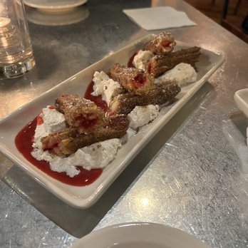 La Bodega - Churros with raspberry filling and whipped cream - Tapas Bars Near Me - Kansas City, Missouri
