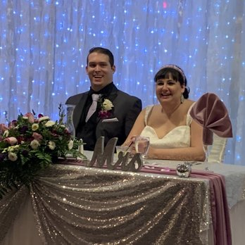 Rainbow Gardens - Bride and groom at Sweetheart table in Rainbow Gardens formal room. - Venues & Event Spaces Near Me - Las Vegas, Nevada Rainbow Gardens - Bride and groom at Sweetheart table in Rainbow Gardens formal room. - Venues & Event Spaces Near Me - Las Vegas, Nevada