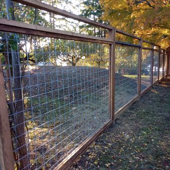 Calmo Landscaping - a fenced in area with trees - Landscaping Near Me Calmo Landscaping - a fenced in area with trees - Landscaping Near Me