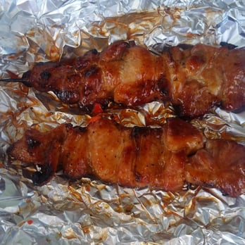 BBQ Stand Outside Island Pacific - Two BBQ pork sticks. The cost is $1.50 per stick. - Filipino Near Me - Union City, California BBQ Stand Outside Island Pacific - Two BBQ pork sticks. The cost is $1.50 per stick. - Filipino Near Me - Union City, California
