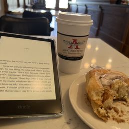 a tablet and a pastry a tablet and a pastry