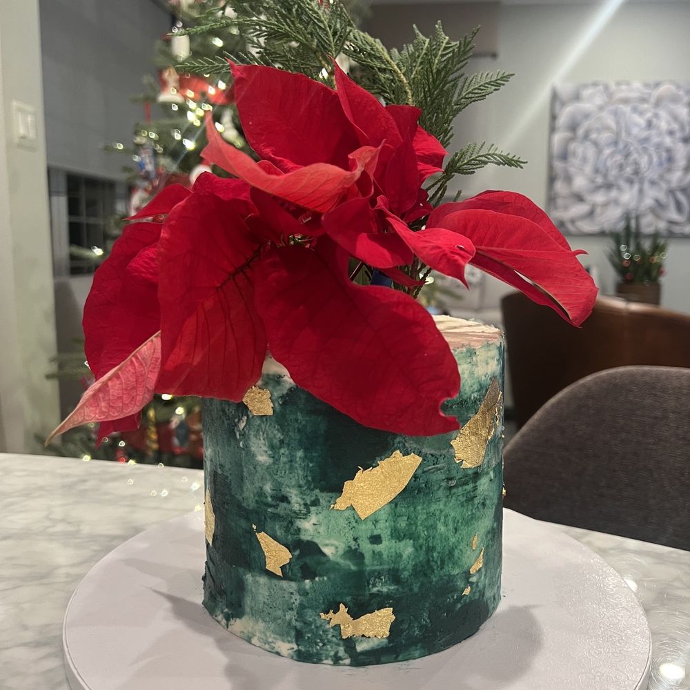 a christmas cake with a poinsettio a christmas cake with a poinsettio