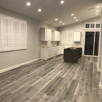 Kimber Company - a kitchen with white cabinets and wood floors - General Contractors Near Me - Whittier, California Kimber Company - a kitchen with white cabinets and wood floors - General Contractors Near Me - Whittier, California