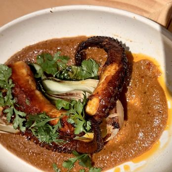 Mayahuel - Pulpo Encacahuatado served on top of bok choy. - Mexican Near Me - Astoria, New York Mayahuel - Pulpo Encacahuatado served on top of bok choy. - Mexican Near Me - Astoria, New York