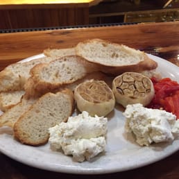 Roasted Garlic Platter with roasted red peppers and Boursin cheese. Outstanding! Roasted Garlic Platter with roasted red peppers and Boursin cheese. Outstanding!