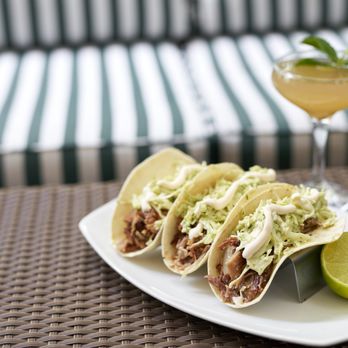 Latin Cafe 2000 - a plate of tacos and a cocktail - Latin American Near Me - Miami, Florida
