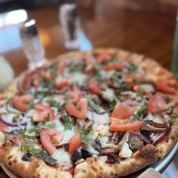 Beau's Pizza, Pasta & Steak - Beaus Special  Fresh basil, fresh tomatoes, pepperoni, sausage, mushrooms, Kalamata olives, roasted onions, garlic, and feta.