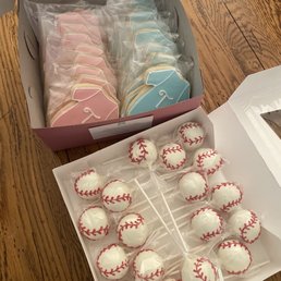 Baseball cake pops and gender reveal onsies Baseball cake pops and gender reveal onsies