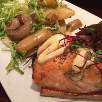 Amelia's - Salmon on wooden plank with fingerling potatoes on a bed or purée. - Bars Near Me - Stoughton, Massachusetts Amelia's - Salmon on wooden plank with fingerling potatoes on a bed or purée. - Bars Near Me - Stoughton, Massachusetts