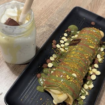D Spot Dessert Cafe - Pistachio crepe stuffed with chocolate cake and a kinder bueno milkshake - Desserts Near Me - Calgary, Alberta D Spot Dessert Cafe - Pistachio crepe stuffed with chocolate cake and a kinder bueno milkshake - Desserts Near Me - Calgary, Alberta