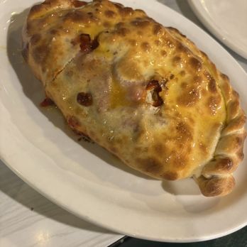 Val's Famous Pizza & Grinders - Pepperoni and Sausage Calzone - Pizza Near Me - Chesterton, Indiana Val's Famous Pizza & Grinders - Pepperoni and Sausage Calzone - Pizza Near Me - Chesterton, Indiana