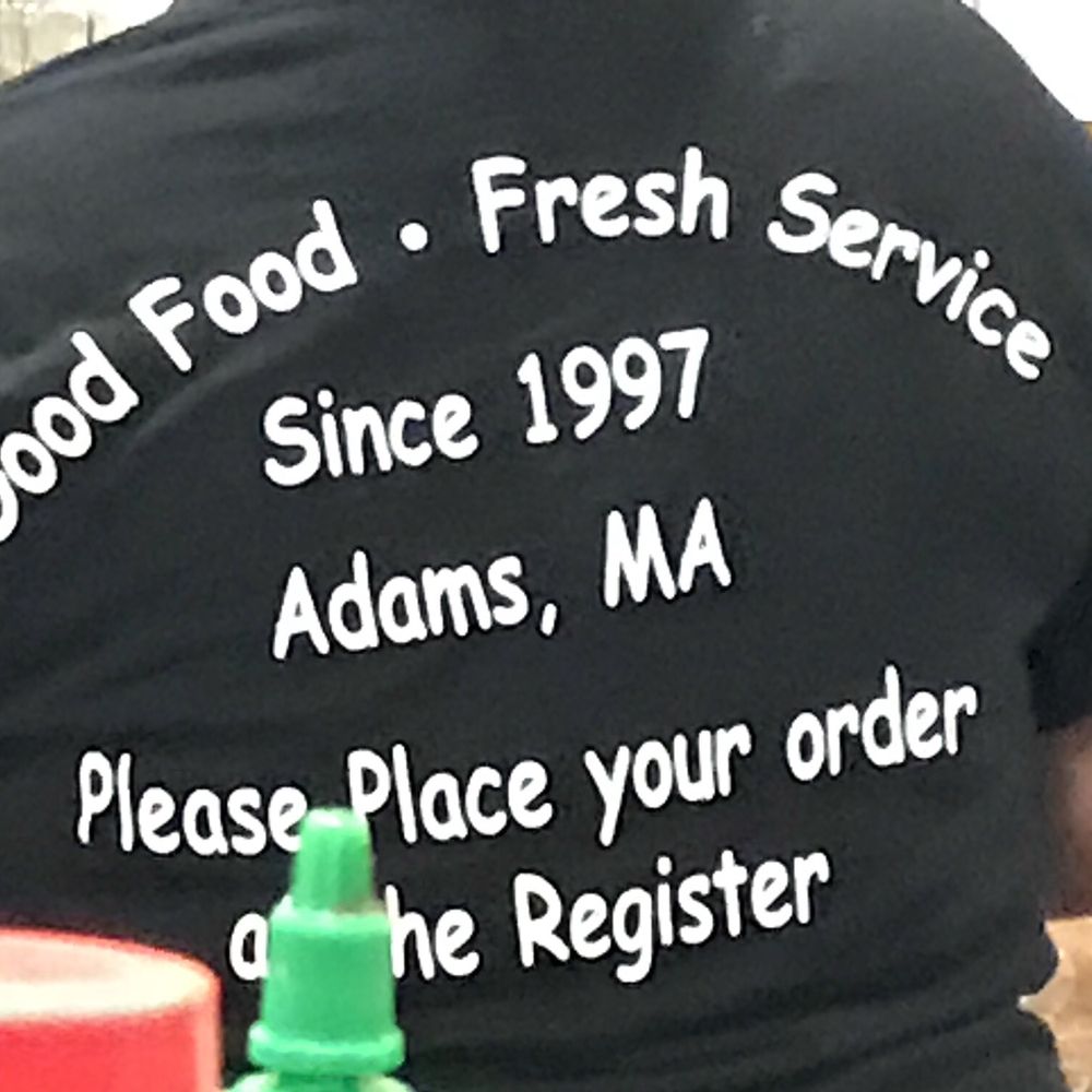 Daily Grind - a man in a black t - shirt that says god food fresh service since 1997 adams, ma please place your order on - Delis Near Me - Adams, Massachusetts Daily Grind - a man in a black t - shirt that says god food fresh service since 1997 adams, ma please place your order on - Delis Near Me - Adams, Massachusetts
