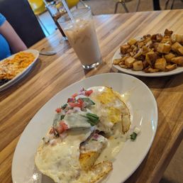 The Texas Benedict with home fries and a chai latte (Migas in the background) The Texas Benedict with home fries and a chai latte (Migas in the background)