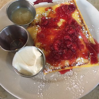 Veselka - Delicious raspberry sauce atop a plate of cheese blintzes - Ukrainian Near Me - New York, New York Veselka - Delicious raspberry sauce atop a plate of cheese blintzes - Ukrainian Near Me - New York, New York