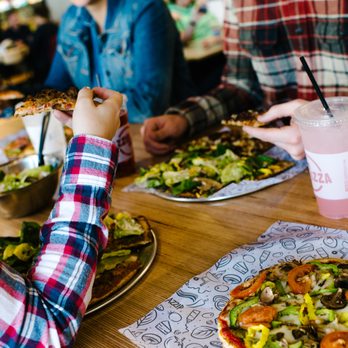 Azzip Pizza - people eating at a restaurant - Pizza Near Me - Evansville, Indiana Azzip Pizza - people eating at a restaurant - Pizza Near Me - Evansville, Indiana