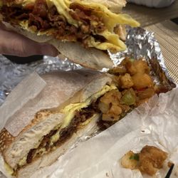 Union Bagel Cafe - Bacon and egg on a sesame bagel. Hash Brown on Side.
