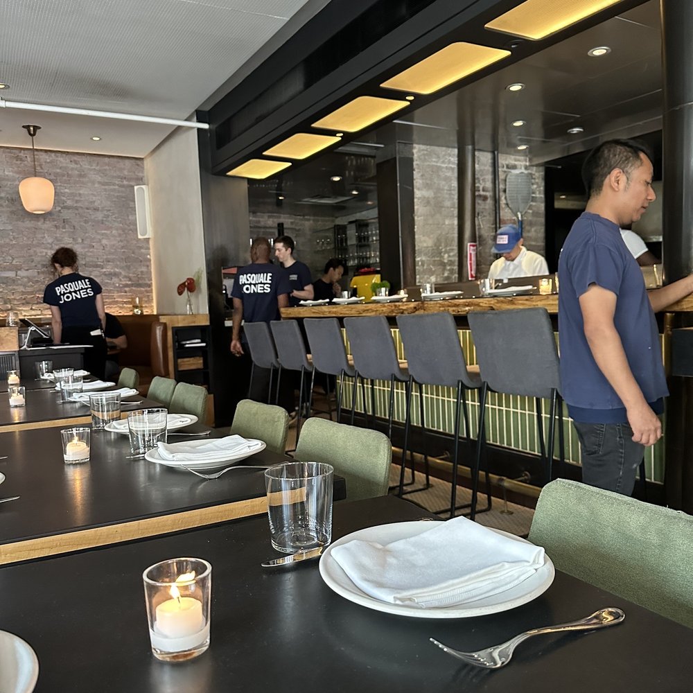 Pasquale Jones - a man standing in a restaurant - Italian Near Me - New York, New York Pasquale Jones - a man standing in a restaurant - Italian Near Me - New York, New York