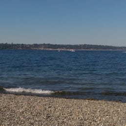 View of Seattle and one of the floating bridges at a distance from the Seward Park Loop. View of Seattle and one of the floating bridges at a distance from the Seward Park Loop.
