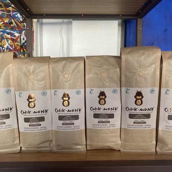 Chik Monk Coffee - five bags of coffee on a shelf - Cafes Near Me - Palm Beach, Florida