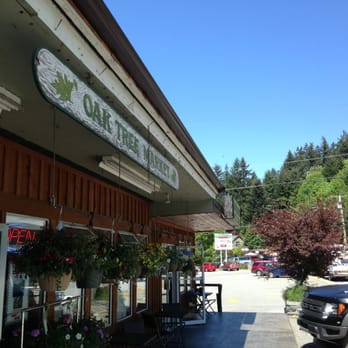 Oak Tree Market - Store front. Hanging baskets for sale. So beautiful. - Grocery Near Me - Madeira Park, British Columbia
