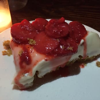 Kiki's - Niko's Cold Cheesecake - topped with fresh strawberry sauce. - Greek Near Me - New York, New York Kiki's - Niko's Cold Cheesecake - topped with fresh strawberry sauce. - Greek Near Me - New York, New York