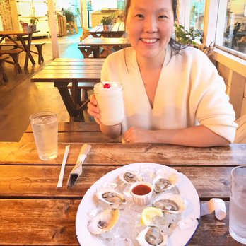 The Contented Sole - Frozen piña colada (in a mason jar) with a paper straw to boot and Damariscotta oysters - Seafood Near Me - New Harbor, Maine The Contented Sole - Frozen piña colada (in a mason jar) with a paper straw to boot and Damariscotta oysters - Seafood Near Me - New Harbor, Maine