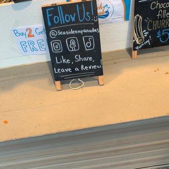 Seaside Empanadas - a chalkboard sign in a shop window - Empanadas Near Me - Seaside Heights, New Jersey