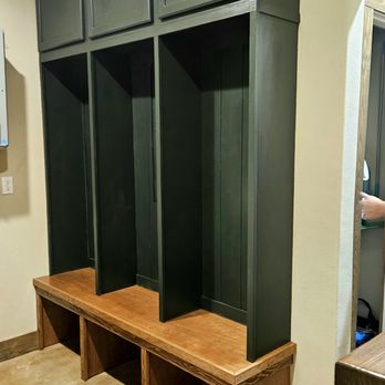 Sweatt's Construction - a man standing in a mud room - Painters Near Me