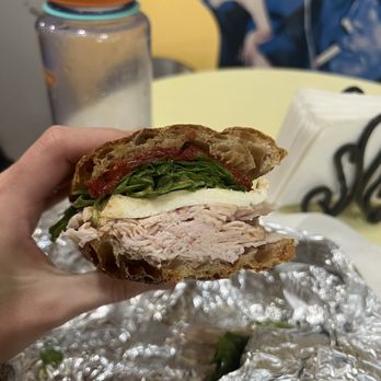 ALIDORO - a person holding a sandwich in their hand - Specialty Food Near Me - New York, New York ALIDORO - a person holding a sandwich in their hand - Specialty Food Near Me - New York, New York