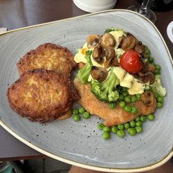 Deutsches Haus - An incredible schnitzel!  Broccoli, peas, mushrooms, and hollandaise.  The rosti were nicely crisp!