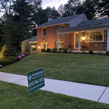 VIP Landscaping - a house with a lawn and a sign in front of it - Landscaping Near Me - Havertown, Pennsylvania