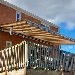 Awnings By Paul - 20 ft retractable awning over the deck
