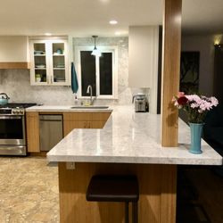 Cutting Edge Granite Marble - Quartz countertop with full back-splash.