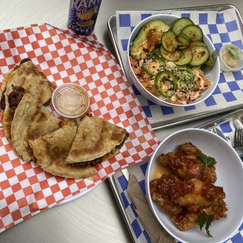 POST Market - Left: Quesadilla from Rolling Phatties Right bottom: Hawker Street Wings Top Right: Spicy Salmon salad from East Side King - Food Court Near Me - Houston, Texas